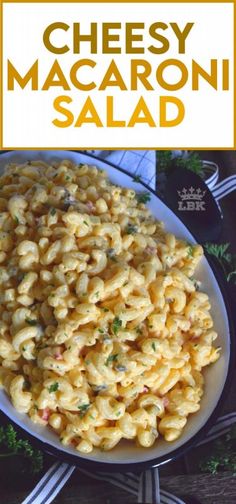 macaroni and cheese salad on a plate with the words cheesy macaroni salad