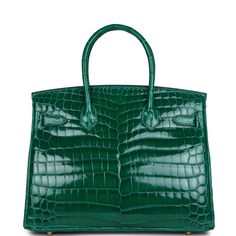 This Birkin is in Vert Emeraude shiny Niloticus crocodile with gold hardware and has tonal stitching, front flap, two straps with center toggle closure, clochette with lock and two keys, and double rolled handles.The interior is lined with Vert Emeraude chevre, has one zip pocket with an Hermes engraved zipper pull and an open pocket on the opposite side.Collection: DOrigin: FranceCondition: Never (Plastic on hardware)Accompanied by: Hermes box, Hermes dustbag, felt, clochette, lock, two keys, c Hermes Orange, Hermes Birkin 35, Hermes Birkin 25, Crocodile Bags, Hermes Birkin 30, Hermes Box, Birkin 25, Crocodile Leather, Hermes Bags