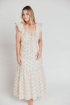 Whether you're frolicking through a field of wildflowers, touring a sunny Greek isle, or attending a springtime baby shower, the Emery Midi Dress will ensure you do it looking like a goddess. We designed this premium dress with an ultra-flattering neckline and a figure-skimming silhouette, paired with a flounced skirt and sweet ruffle details. The Emery is guaranteed to be one of your most feminine (and most favorite!) pieces. FIT: Runs very fitted. This dress is designed with a fit-and-flare profile, and is fitted through the waist and hips. Fabric does not stretch, so we recommend sizing up for more room in the hips MATERIAL: Self: 75% Rayon, 25% Nylon; Lining: 100% Cotton. GARMENT DETAILS: Lightweight summer dress in a long midi length and pastel floral print chiffon. Features a square Flounced Skirt, Field Of Wildflowers, Greek Isles, Garment Details, Long Midi, Floral Print Chiffon, A Goddess, Pastel Floral, Print Chiffon