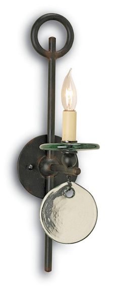 a wall light with a candle on it and a glass plate hanging from the side