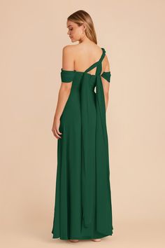 a woman wearing a green dress with one shoulder tied at the waist and an open back