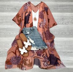 Add a touch of whimsy to your wardrobe with the Brooke Floral Kimono. This versatile piece features a playful floral pattern and can be worn as a cover-up, top, or a fun and unique look. Embrace your playful side with the Brooke Floral Kimono! Size: 42" x 34.5" One Size 2- 18 Printed Summer Cover-up For Day Out, Casual Cotton Summer Cover-up, Casual Multicolor Boho Print Cover-up, Beachy Spring Cover-up, Spring Cotton Cover-up For Day Out, Casual Cotton Beach Season Cover-up, Spring V-neck Relaxed Fit Cover-up, Floral Print Tops For Vacation Day Out, Flowy Open Front Top For Beach