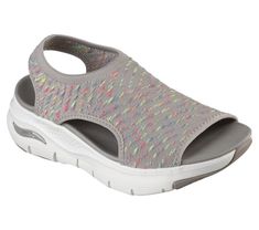 Take a walk in unique style and superior support wearing Skechers Cali Arch Fit - Catchy Wave. This slip-on sandal features a breathable Stretch Fit engineered knit upper and an Arch Fit cushioned footbed. | Skechers Women's Arch Fit - Catchy Wave Sandals | Medium Width | Patented Skechers Arch Fit contoured footbed with podiatrist-certified arch support | Podiatrist-designed shape developed with 20 years of data and 120, 000 unweighted foot scans | Contoured footbed helps mold to your foot to r Skechers Sandals, Shoes Flats Sandals, Lace Up Wedges, Take A Walk, Skechers Women, Lace Boots, A Walk, Arch Support, Shoe Shop