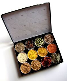 an open box filled with different types of spices