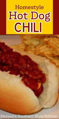 a hot dog with chili on it next to some french fries and potato wedges