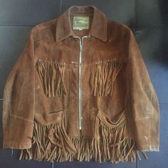 "Brown suede in good condition, circa 1970's with zipper front and plenty of fringe. Brass rivets with rich patina. Jacket has true vintage wear and hasn't been worn for many years. Size 14 in women's Model size women's small. 18\" armpit to armpit 16\" shoulder to shoulder 18\" sleeve 23\" collar to hem including fringe" Vintage Fringed Winter Outerwear, Vintage Winter Outerwear With Fringe, Vintage Fringe Outerwear For Winter, Vintage Winter Leather Jacket With Fringe, Vintage Leather Jacket With Fringe For Winter, Vintage Fringe Leather Jacket For Winter, Vintage Brown Fringed Outerwear, Vintage Brown Fringe Outerwear, Vintage Jackets Women