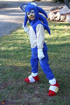 a person in a sonic costume standing on the grass