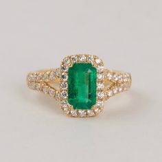 A vibrant emerald wrapped in a lovely diamond bodice. Materials - 18k yellow gold, Columbian Emerald, Diamond Weights - 1.15ct Emerald, 0.76ct Diamond Size﻿ - 6.5 Columbian Emeralds, Emerald Gem, Halo Setting, Colombian Emeralds, Emerald Pendant, Halo Diamond Ring, Natural Emerald, Diamond Sizes, Emerald Diamond