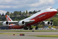 an airplane taking off from the runway at an airport with it's landing gear down