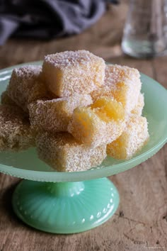 some sugar cubes are on a green plate