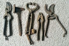 five old tools are laying on the floor