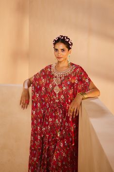 Featuring a floral-printed kaftan and sharara. The kaftan’s neckline is embroidered by hand using a mirror, sequences, and beadwork. The tie-up is accentuated with mirrors and the kaftan hem is accentuated with antique gold coins.From Aneesh Agarwaal's Seher collection.DELIVERY TIMEPlease allow 8-12 weeks for your outfit to arrive.FABRIC DETAILSChinonProfessional cleaning only.