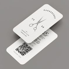 two business cards with scissors and qr code printed on the front, one for barbers