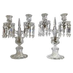 three crystal candelabra candlesticks are shown in different positions on a white background