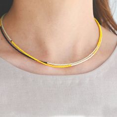 A Yellow Sun double stranded beaded necklace by Abacus Row is a sunny bright palette of pink and yellow hues accented with sharp black detail to welcome a bright and hopeful summer. Wear it with your fave maxi dress or tee and jean shorts! ONLY 1 LEFT! Yellow Necklaces For Beach, Yellow Necklaces For Beach Occasion, Yellow Bohemian Single Strand Beaded Necklace, Bohemian Yellow Single Strand Beaded Necklace, Yellow Multi-strand Beaded Necklaces For The Beach, Bright Palette, Yellow Hues, Yellow Sun, Latest Jewellery