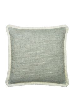 a gray and white pillow with fringe trim