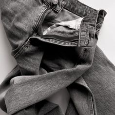 a pair of jeans that are folded up