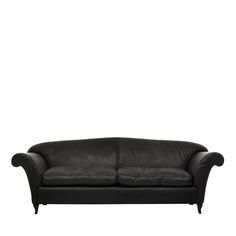 a black leather couch against a white background