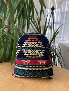 All our products are handmade unique products, so stocks are limited to 1. each has a different motif. It has the texture of a real rug. Dimensions: Length 26 cm, Width 23 cm Design: navy backpack with unique ethnic kilim rug pattern Durability: Built to last, ensuring long-term use Distinctive Ethnic Patterns: Eye-catching ethnic motifs on a navy background Exceptional Craftsmanship: Meticulously made, showcasing expert workmanship Artisanal Aesthetic: Captures the essence of traditional ethnic Traditional Travel Backpack, Traditional Backpack For Daily Use, Bohemian Tote Backpack For Daily Use, Traditional Shoulder Bag Backpack For Everyday Use, Artisan Handmade Backpack For Daily Use, Handmade Shoulder Bag Backpack, Bohemian Handmade Backpack For Travel, Traditional Multicolor Backpack For Travel, Bohemian Woven Backpack For Everyday Use