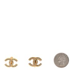 This is an authentic pair of CHANEL Crystal CC Clip On Earrings in Gold. These stylish clip-on earrings feature a textured light gold Chanel CC logo set with brilliant crystals. Gold Chanel, Chanel Earrings, Chanel Jewelry, Logo Set, Earrings In Gold, Cc Logo, Earrings Gold, Clip On, Clip On Earrings