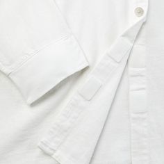 Take on your day with confidence and effortless style with this Long-Sleeve Adaptive Button-Down Shirt from Universal Thread™. This shirt is designed with side slits with hook-and-loop closures to allow for a better fit for the seated guest. Made from 1x1 rib canvas cotton-blend fabric, it features a collared neck, chest patch pocket and turnback hem for touches of timeless style. Wheelchair Friendly or Seated Fit products are intended for someone who uses a wheelchair, someone who is not ambula White Tops With Roll-up Sleeves For Everyday, Solid Shirt With Button Cuffs For Everyday Wear, Everyday Tops With Roll-up Sleeves, White Button-up Top For Loungewear, Relaxed Fit Shirt With Buttons For Loungewear, Everyday Shirt With Shirttail Hem And Placket, White Collared Top With Roll-up Sleeves, Everyday Shirt With Rolled Sleeves And Shirttail Hem, Everyday Shirt With Placket And Shirttail Hem