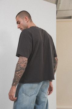 A trend-forward take on our Oversized Core Tee with a shorter, cropped fit that hits at the waist. Inspired by your favorite vintage t-shirt, featuring a boxy fit and hand-distressed details. Garment washed for that worn-in feel. 100% ORGANIC COTTON 6 OZ JERSEY OVERSIZED FIT CROPPED LENGTH SINGLE STITCHED Men’s Cropped Tshirts, Cropped Shirt Men, Skate Outfit Men, Cropped Tshirts, Elwood Clothing, Skate Outfit, Cropped Outfits, Cropped Jersey, 2024 Moodboard