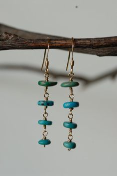 These earrings are beautiful and unique. They are a perfect addition to any outfit.  Each turquoise heishi bead was hand picked and wire hand formed to create the beautiful tiered style of these earrings.Thank you for supporting my small business! :)<3 Stephanie Turquoise Bohemian 14k Gold-filled Earrings, Turquoise 14k Gold Filled Bohemian Earrings, Bohemian Turquoise 14k Gold-filled Earrings, Bohemian Turquoise 14k Gold Filled Earrings, Turquoise Gold Bohemian Earrings, Turquoise 14k Gold Filled Earrings, Turquoise 14k Gold Filled Drop Earrings, Handmade 14k Gold Filled Dangle Linear Earrings, Turquoise 14k Gold-filled Earrings With Ear Wire