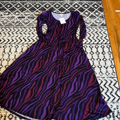 Brand New With Tags Lularoe Ryane Dress. Long Sleeve Empire Waist Dress. Flowy Skirt Fitted Top. Cute Zebra Pattern With Magenta, Purple And Black. Cotton Material. Comes From A Smoke Free Home Purple Stretch Midi Dress, Long Sleeve Peasant Dress, White High Low Dress, Lularoe Nicole Dress, Magenta Purple, Lularoe Carly Dress, Amelia Dress, Zebra Pattern, Dress Flowy