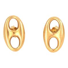 This lovely authentic pair of earrings by Gucci. Crafted from 18k yellow gold with a polished finish featuring a single long oval puffed link in stud style. Comes with standard post and has the designer hallmark with the gold content.    Brand:  Gucci   Hallmark: Gucci 750  Material: 18k yellow gold  Measurement: 0.65" long x 0.39" wide x 0.10" high  Weight: 2.3 grams Gucci Earrings Gold, Stud Style, Link Earrings, Hallmark, Gold Earrings, Yellow Gold, Stud Earrings, Gucci, My Style