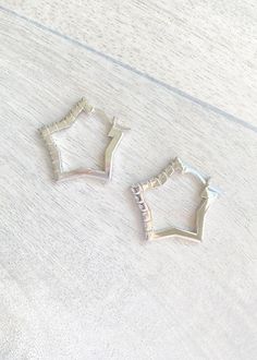 DETAILS: .925 Sterling Silver Rhodium plated sterling silver Cubic Zirconia crystals Small hoop earrings in the shape of a star Small Hoop Earrings, Crystal Stars, The Shape, Designer Earrings, Crystal Earrings, Rhodium Plated, Sterling Silver Earrings, Wedding Shoe, Silver Earrings