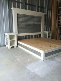 an unfinished bed frame in a garage