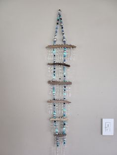 a wall hanging made out of glass beads