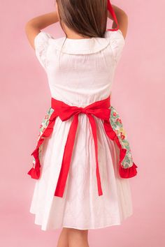 Say hello to the Mini Ivy Half Apron in Strawberry Cotton - a charming blend of functionality & fun for your summer kitchen adventures! Made for making magical memories in the kitchen with those you love! Full of a delightful green, red, yellow, & cream cotton fabric sprinkled with sweet strawberry prints! Its features front pockets & a darling red ruffled hem, adding a pop of color & flair to your culinary masterpieces! With its easy tie-back closure, our half apron ensures both style & practic Strawberry Prints, Half Apron, Summer Kitchen, Strawberry Print, Yellow Cream, Matches Fashion, Say Hello, Red Yellow, The Kitchen