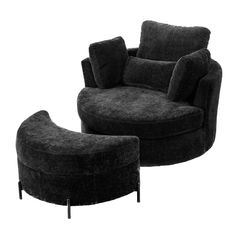 a black chair and ottoman sitting next to each other