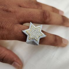 "Iced out ring Star Ring Diamond Star Ring Star Shaped ring Star Rings Iced Out Star Ring Big ring Fashion Ring Pinky Ring, Iced out ring, Star Ring, Diamond Star Ring, Star Shaped ring, Star Rings, Iced Out Star Ring, Big ring, Fashion Ring, Pinky Ring, UK, Star Ring, Custom Handmade 3-D Star Hip Hop Pinky Ring,925 Sterling Silver Star Ring, Hip Hop Moissanite Ring, Star Iced Out Moissanite Ring ✢ Handmade Item Shop ✢ Diamond: Moissanite / Stimulated / Lab Stone ✢ Material: 925 Sterling Silver ✢ Can Be Personalized Item ✢ If you have any questions, share with me anytime. ✢ We gladly accept custom orders too. ✦ Center Stone Details:   ◈ Shape:  Round Diamond ◈ Weight: 15.23 CT (Approx ) ◈ Diamond: Moissanite / Stimulated ◈ Color: Colorless ◈ Clarity: VS / VVS1 ◈ Luster: Excellent ◈ Make: H Tupac Star Ring, Diamond Star Ring, Silver Star Ring, Star Rings, Like Symbol, Fire Jewelry, Ice Star, Big Ring, Ring Fashion