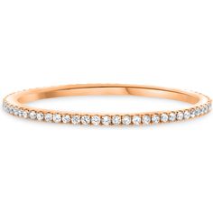 a rose gold wedding band with rows of diamonds on the side, set in 18k yellow gold