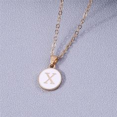 Add a personalized touch to your look with our YourLetter White Enamel Circle Necklace. Crafted with a white enamel background and gold color detailing, the necklace comes with a choice of single letter pendant. A great way to show off your initials or those of someone you love. Necklace For Women Gold, Alphabet Pendant, Party Necklace, Single Letter, Jewelry Birthday, Custom Initials, Birthday Jewelry Gift, Letter Pendants, Circle Necklace