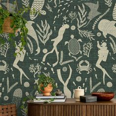 the wallpaper in this room is decorated with green and white designs