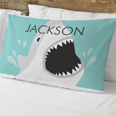 a pillow that has a shark on it