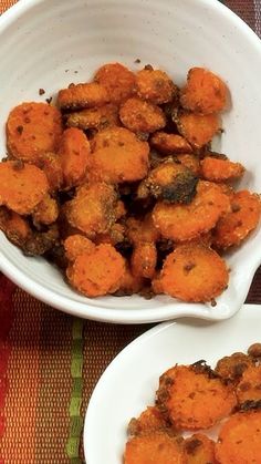 two white bowls filled with fried food on top of a tablecloth covered table cloth