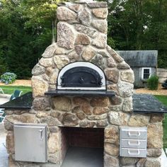 an outdoor pizza oven is built into the ground