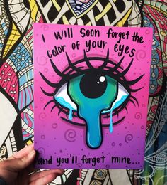 someone holding up a card that says i will soon forget the color of your eyes and you'll forget mine