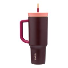 a purple and pink cup with a straw sticking out of it's side, on a white background