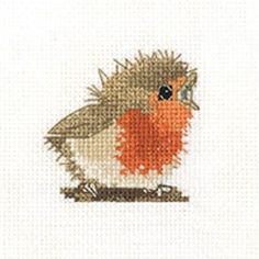 a cross stitch picture of a bird with an orange breast and black eyes, sitting on a branch