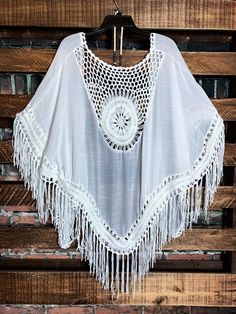 One Size (Fit up to 2X) Crochet Peasant Hand Wash Cold Wash 65% Polyester 35% Cotton Measurements Approx.;Back Length: 44/45 "(including tassel-Fringe)Bust Across: 48/49 " (including both side tassels-Fringe)Armhole: 14/14.5 " Tassel Length: 9/9.5 " ***Jewelry & Slip Sold Separately Extender top slip title; FULL OF GRACE LACE SLIP DRESS EXTENDER TOP IN IVORY One Size Fringe Tops For Spring, Spring White Free Size Kimono, White Bohemian Tops For Beach Season, White Free Size Kimono For Spring, White Summer Poncho For The Beach, White Summer Poncho For Vacation, White Summer Poncho For Beach, White Beachwear Poncho For Vacation, White One Size Tops For Vacation