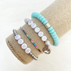 the bracelets are decorated with buttons and beads