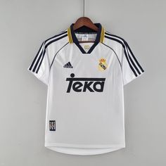 the jersey worn by real madrid is hanging on a hanger