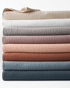 folded sheets in various colors and patterns