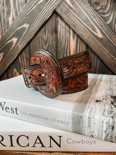 A full tooled leather belt with matching leather buckle. A statement to any outfit. 100% Leather Belt Width: 1.5" Small 32" | 30"-34" Medium 36" | 34" - 38" Large 40" | 38" - 42" **All measurements are taken from top of the belt to the first and then to the last hole** Buckle can be removed Tooled Belt, Tool Belt, Poly Mailers, Tooled Leather, Leather Buckle, Leather Tooling, Pet Hair, Shoe Box, Leather Belt