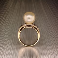 Fine Quality South Sea Pearl and Diamond Ring Size 7 set in 14k Yellow Gold 0.14 CTs Certified $6,950 911035 This is a Unique Custom Made Glamorous Piece of Jewelry! Nothing says, “I Love you” more than Diamonds and Pearls! This South Sea pearl ring has been Certified, Inspected, and Appraised by Gemological Appraisal Laboratory Gemological Appraisal Laboratory of America is a proud member of:- GIA Alumni Association- National Association of Jewelry Appraisers- International Consortium Gem-Testi Diamond White Pearl Ring With Diamond Accents, Luxury Pearl Ring With Diamond Accents For Promise, Exquisite 14k Gold Rings For Formal Occasions, Luxury Brilliant Cut Pearl Promise Ring, Luxury Pearl Promise Ring With Brilliant Cut, Timeless Pearl Ring With Diamond Accents For Anniversary, Timeless Anniversary Pearl Ring With Diamond Accents, Elegant Gold Sapphire Ring For Wedding, Fine Jewelry Pearl Ring With Diamond Accents